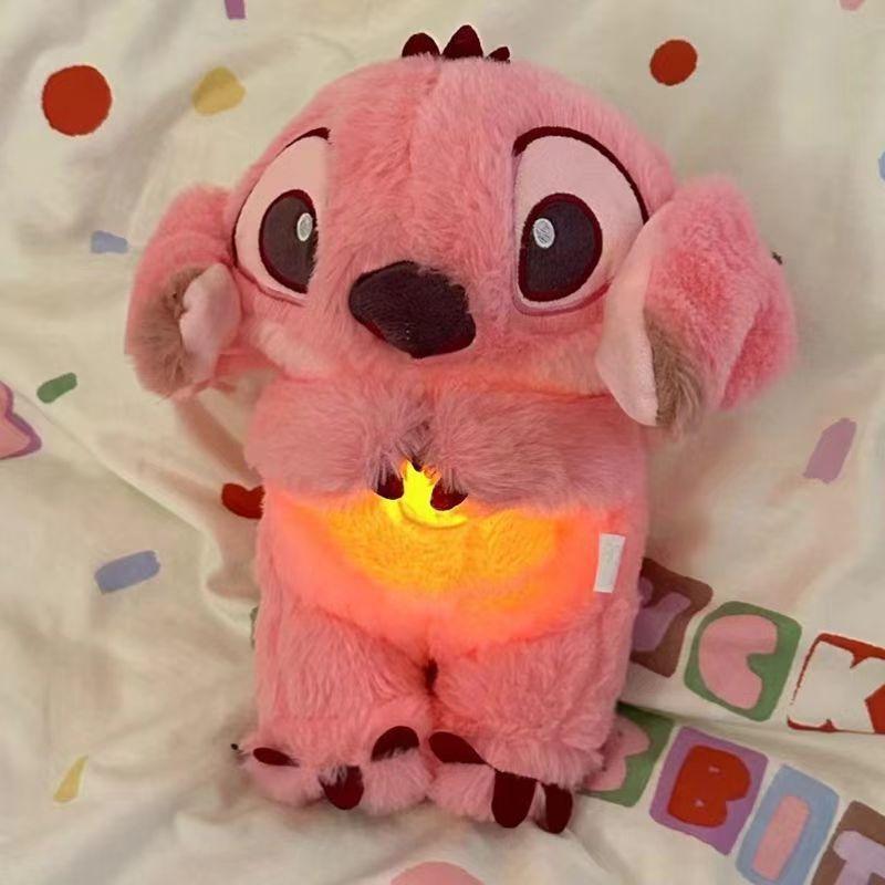 Breathing stuffed animal bag charmfeatures realistic breathing, lights andmusic to relieve anxiety and is an idealsleep companion