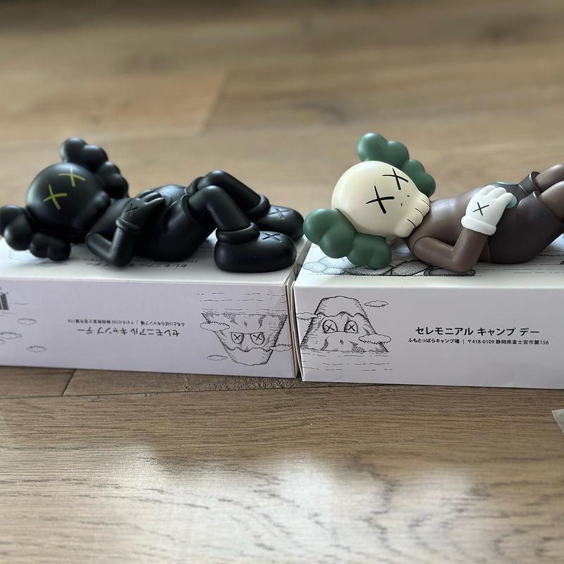 Laying down KAWS mini figure