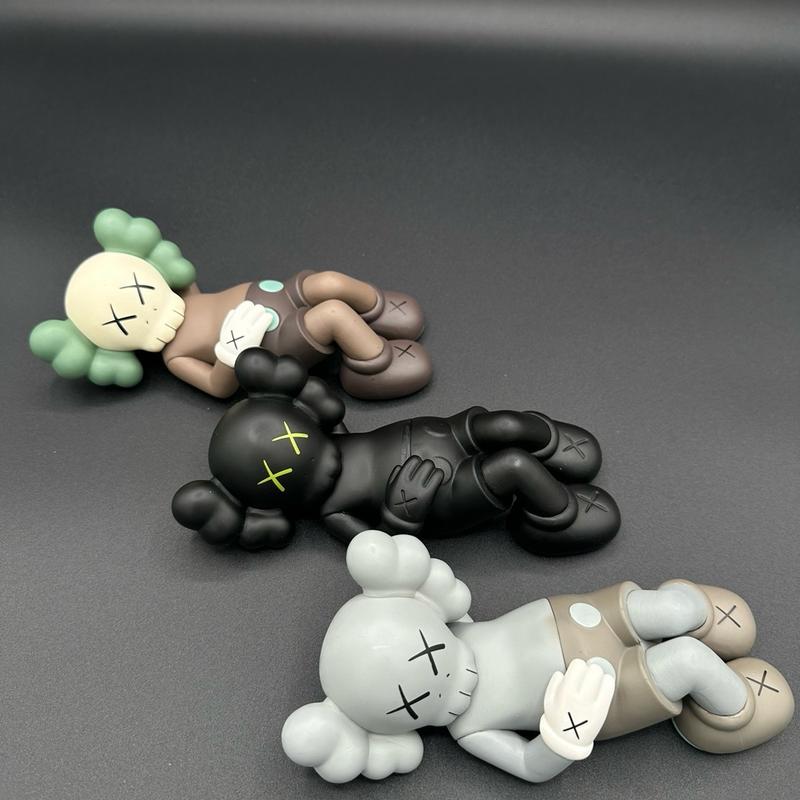 Laying down KAWS mini figure