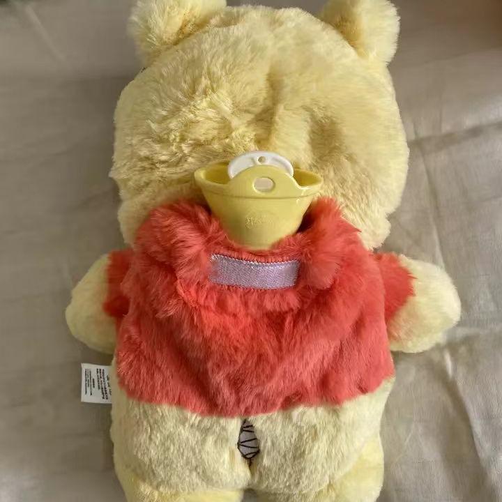 Winnie the Po-oh premium plush toy Cute cartoon character with furry texture and embroidered details Comes with classic rubber hot water bottle