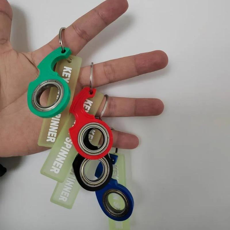 Fingertip Rotating Keychain Anti-Stress Toy: Decompression Keychain with Red, Black, Blue, And Green Options - Adult Sensing Toy for Stress Relief